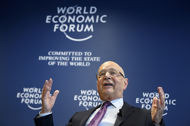 
              German Klaus Schwab, founder and president of the World Economic Forum, WEF, gestures during a press conference, in Cologny near Geneva, Switzerland, Tuesday, Jan. 10, 2017. The World Economic Forum unveiled the program for its annual meeting in Davos, Switzerland, including the key participants, themes and goals. The overarching theme of the meeting, which will take place from Jan. 17 to 20, is "Responsive and Responsible Leadership". (Laurent Gillieron/Keystone via AP)
            