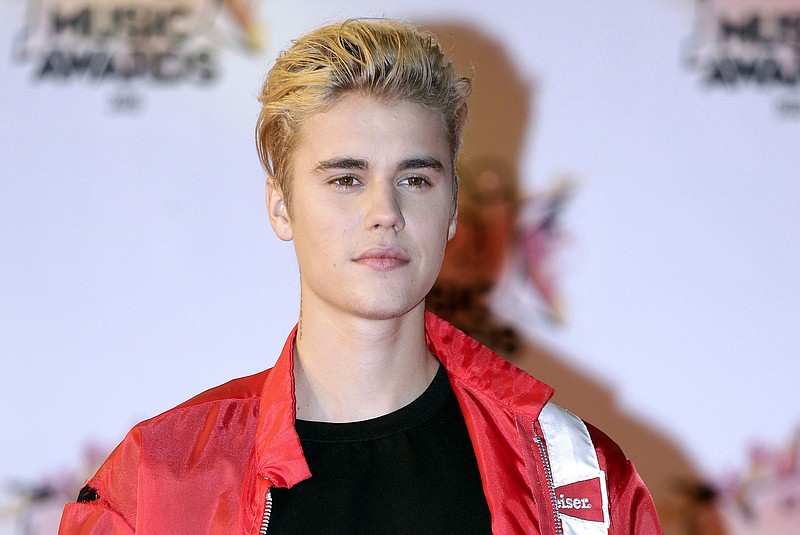 
              FILE - In this Nov. 7, 2015 file photo, Justin Bieber arrives at the Cannes festival palace in Cannes, southeastern France. Bieber's custom-built 2011 Ferrari 458 Italia is on the auction block. the car can be previewed in person in Scottsdale, Ariz., on Jan. 14 and 15, 2017. (AP Photo/Lionel Cironneau, File)
            