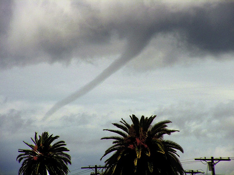 
              FILE - In this Tuesday, Feb. 22, 2005 file photo, a funnel cloud is seen over the Pacific Ocean off Venice Beach in Los Angeles. On Tuesday, Jan. 10, 2017, a twister touched down south of the state capital and registered EF0, at the lowest edge of the tornado scale that goes up to EF5. The Enhanced Fujita (EF) scale measures the intensity of tornadoes in the U.S. and Canada based on damage caused. (AP Photo/Chris Kim, File)
            