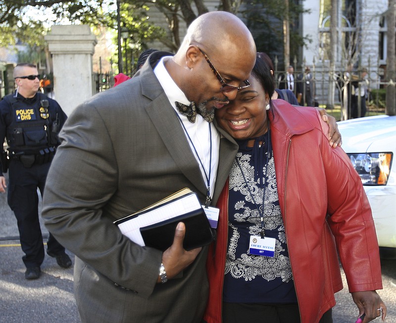 
              The Rev. Eric Manning, pastor at Emanuel AME, leaves the Federal Court House after the death sentence hearing for Dylann Roof on Wednesday, Jan. 11, 2017 in Charleston, S.C. (Leroy Burnell/The Post And Courier via AP)
            