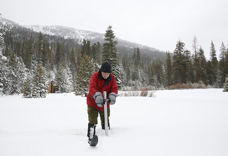 
              FILE - In this Jan. 3, 2017, file photo, Frank Gehrke, chief of the California Cooperative Snow Surveys Program for the Department of Water Resources, plunges the survey tube into the snowpack as he conducts the first snow survey of the season at Phillips Station near Echo Summit, Calif.  More than 40 percent of California has emerged from a punishing drought that covered the whole state a year ago, federal drought-watchers said Thursday, Jan. 12,   a stunning transformation caused by an unrelenting series of storms in the North that filled lakes, overflowed rivers and buried mountains in snow. (AP Photo/Rich Pedroncelli, File)
            
