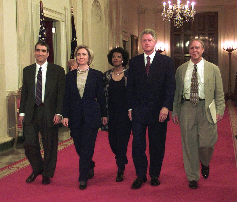 
              FILE - In this Wednesday, April 22, 1998 file photo, President Clinton and first lady Hillary Rodham Clinton walk down the State Floor hallway with Poets Laureate Robert Pinsky, left, Rita Dove, center, and Robert Haas, right, before the Millennium Evening Lecture at the White House in Washington. America's leading poets, including Pinsky and Dove, are averse to Donald Trump, and they have organized literary rallies in more than 30 states, which will be held on Sunday, Jan. 15, 2017, to say so. (AP Photo/Susan Walsh, File)
            