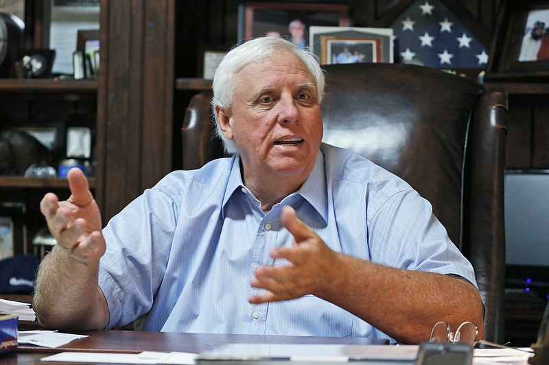
              FILE - In this Tuesday, June 28, 2016 file photo, Democratic gubernatorial candidate, Jim Justice, and owner of the Greenbrier Resort, recounts people lost during recent flooding during an interview at the Greenbrier Resort in White Sulphur Springs, W. Va. Justice, the richest man in the state, is about to be sworn in as governor. He has extensive holdings in the coal, real estate and resort industries. Like President-elect Trump, he is putting his business empire in the hands of family members. And like Trump’s plan, the governor’s arrangement has fallen short of what some ethics watchdogs would prefer to see. (AP Photo/Steve Helber, File)
            