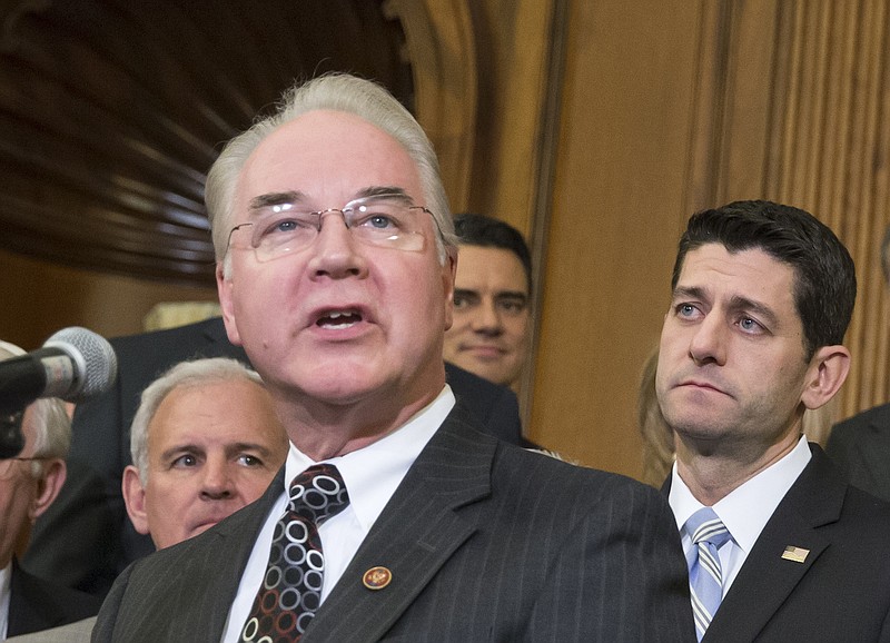 In this Jan. 7, 2016 file photo, Health and Human Services Secretary-designate Rep. Tom Price, R-Ga., speaks on Capitol Hill in Washington as House Speaker Paul Ryan of Wis. listens at right. Price says he will sell off stock holdings to avoid any conflicts of interest, or the appearance of a conflict. (AP Photo/J. Scott Applewhite, File)