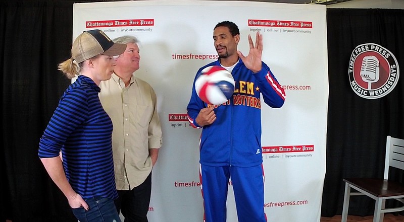 Wun Versher of the Harlem Globetrotters amazes Barry Courter and Lesley Dale with his amazing basketball skills ahead of next Friday's event at UTC's MacKenzie Arena.