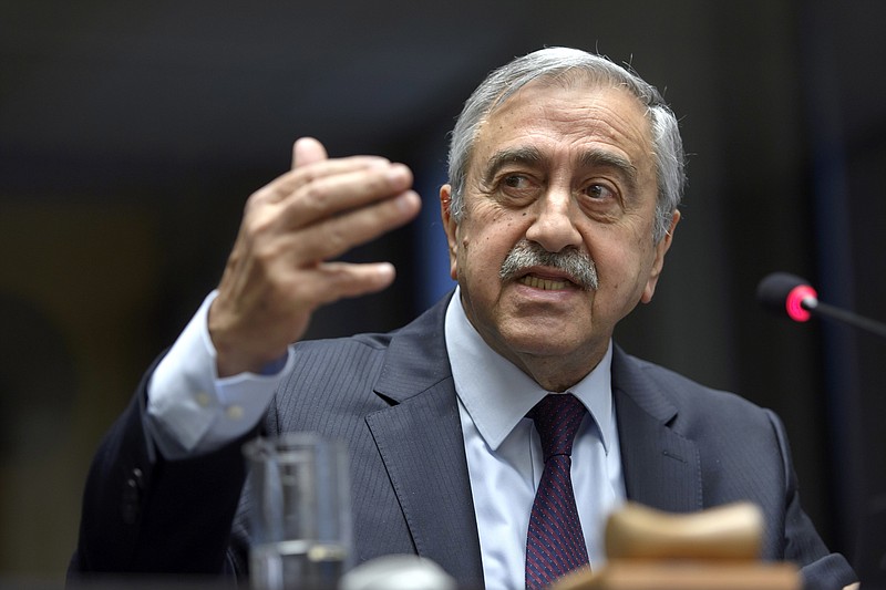 
              Turkish Cypriot leader Mustafa Akinci speaks to the media about the Cyprus Peace Talks, during a press conference at the European headquarters of the United Nations in Geneva, Switzerland, on Friday, Jan. 13, 2017.  (Martial Trezzini/Keystone via AP)
            