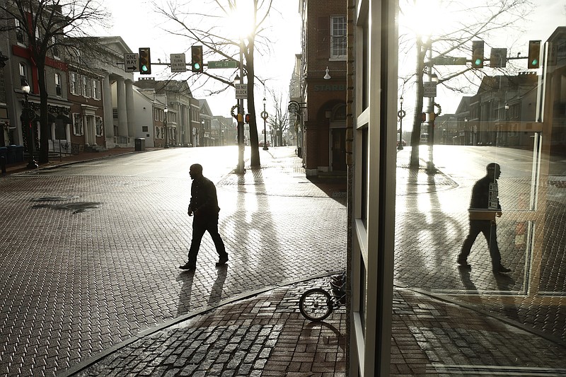 
              ADVANCE FOR USE TUESDAY, JAN. 17, 2017 AND THEREAFTER-A pedestrian walks along Gay Street in West Chester, Pa., Wednesday, Jan. 4, 2017. Chester is the richest county in Pennsylvania; it is majority Republican, but Democratic presidential candidate Hillary Clinton won here easily in 2016. (AP Photo/Matt Rourke)
            