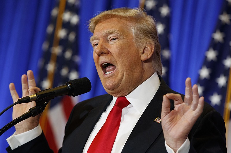 
              FILE - In this Jan. 11, 2017 file photo, President-elect Donald Trump speaks during a news conference in the lobby of Trump Tower in New York.  Trump says his team will have a “full report on hacking within 90 days,” and is again dismissing as fake a document alleging Russia has damaging information about him. (AP Photo/Evan Vucci)
            