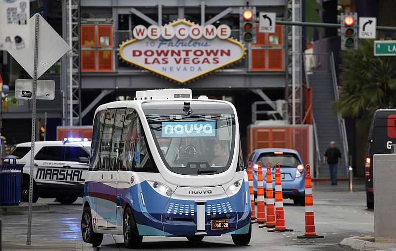 
              In this Jan. 12, 2017, photo, the Navya Arma autonomous vehicle drives down a street  in Las Vegas. The driverless electric shuttle has begun carrying passengers in a test program in a downtown Las Vegas entertainment district. (AP Photo/John Locher)
            