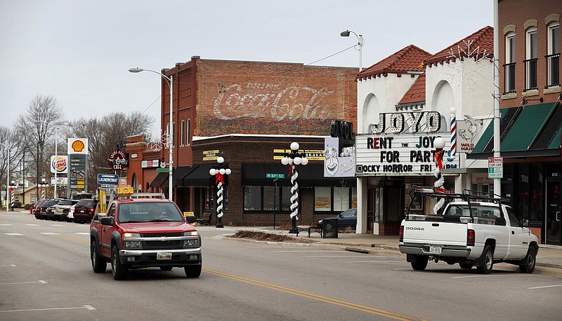 
              ADVANCE FOR USE TUESDAY, JAN. 17, 2017 AND THEREAFTER-A driver in a pickup truck makes his way past businesses in Lincoln, Neb., on Wednesday, Jan. 4, 2017. Lancaster County is among the most evenly split on political lines of any major county in the nation. (AP Photo/Charlie Neibergall)
            