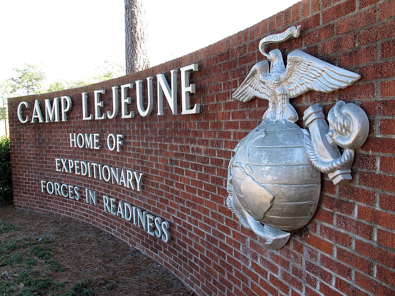 
              FILE - In this March 19, 2013 file photo, the globe and anchor stand at the entrance to Camp Lejeune, N.C. The Obama administration has agreed to provide disability benefits totaling more than $2 billion to veterans who had been exposed to contaminated drinking water while assigned to Camp Lejeune in North Carolina.  (AP Photo/Allen Breed, File)
            