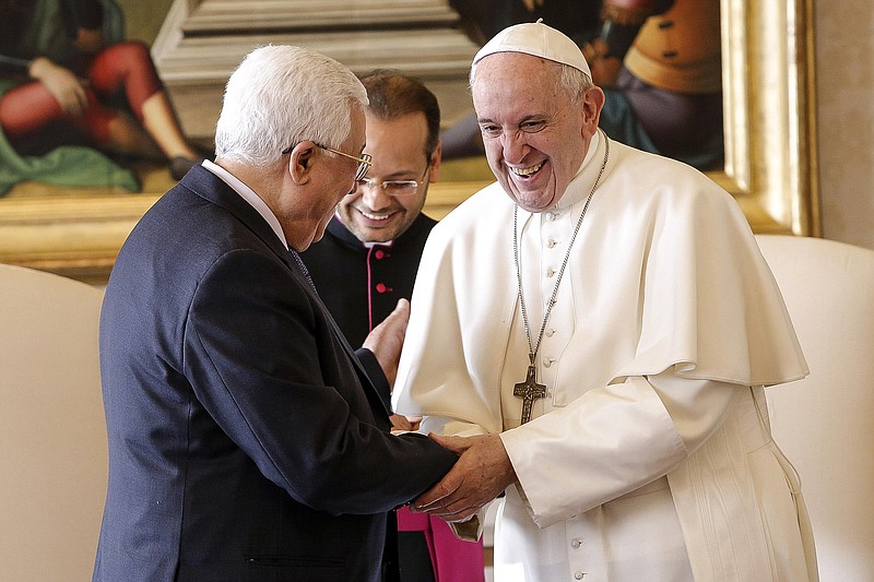 
              Pope Francis shakes hands with Palestinian President Mahmoud Abbas during a private audience at the Vatican, Saturday, Jan. 14, 2017.  (Giuseppe Lami/ANSA pool via AP)
            