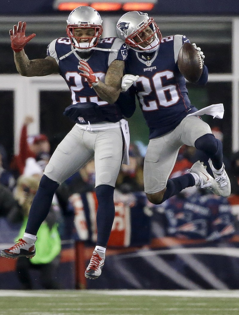 
              New England Patriots cornerback Logan Ryan (26) celebrates his interception with Patrick Chung, left, during the second half of an NFL divisional playoff football game against the Houston Texans, Saturday, Jan. 14, 2017, in Foxborough, Mass. (AP Photo/Elise Amendola)
            