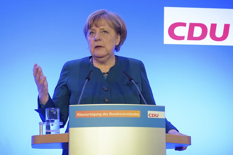 
              German chancellor Angela Merkel speaks at a news conference in Perl,  southwestern Germany, Saturday, Jan. 14, 2017. German Chancellor Angela Merkel is stressing ahead of President-elect Donald Trump's inauguration her conviction that the world's problems need solving in cooperation, rather than by each country individually. Leaders of her conservative Christian Democratic Union, CDU, met Friday and Saturday in Perl, in western Saarland state, to kick off the election year _ which also features three state elections, the first in Saarland in March.  (Oliver Dietze/dpa via AP)
            