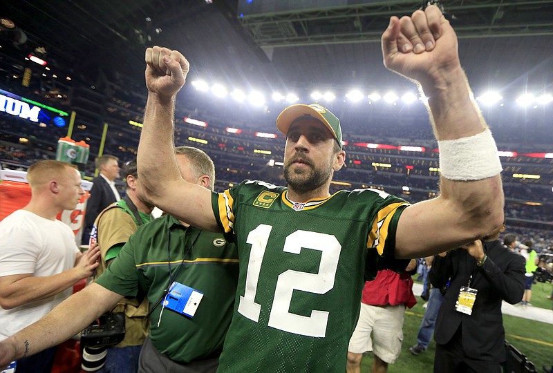 
              Green Bay Packers quarterback Aaron Rodgers (12) celebrates after winning an NFL divisional playoff football game against the Dallas Cowboys Sunday, Jan. 15, 2017, in Arlington, Texas. The Packers won 34-31. (AP Photo/Ron Jenkins)
            