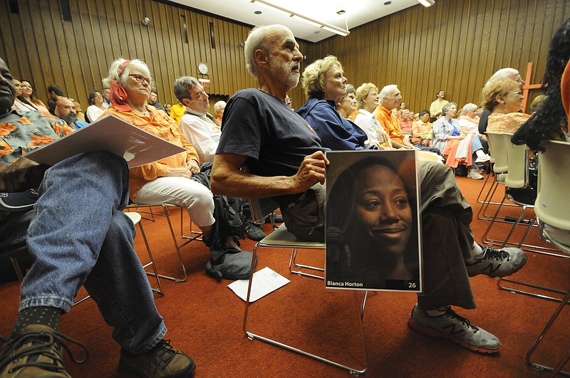 Bill Reynolds holds a photo of Bianca Horton at the National Day of Gun Violence Awareness meeting at The Public Library in June. There were 29 homicides in the city from June 1, 2015, through June 1, 2016. All were victims inside the city limits of Chattanooga.