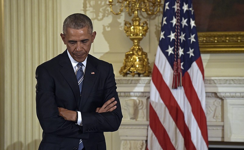 
              President Barack Obama listens as Vice President Joe Biden speaks during a ceremony in the State Dining Room of the White House in Washington, Thursday, Jan. 12, 2017, where Obama presented him with the Presidential Medal of Freedom. An unusually young ex-president, Barack Obama has a busy life awaiting him after he leaves the White House.   There's a library to build, money to raise, causes to fight for and a book to write. (AP Photo/Susan Walsh)
            