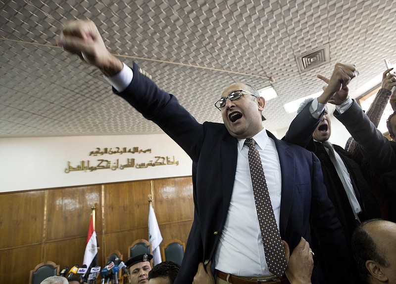 
              Egyptian lawyer and former presidential candidate Khaled Ali celebrates after the Supreme Administrative Court said two islands, Sanafir and Tiran, are Egyptian, debunking the government's claim that they were Saudi, in Cairo, Egypt, Monday, Jan. 16, 2017. An Egyptian court has ruled against the government's decision to hand over two Red Sea islands to Saudi Arabia, a landmark verdict likely to deepen tension with the kingdom. (AP Photo/Amr Nabil)
            