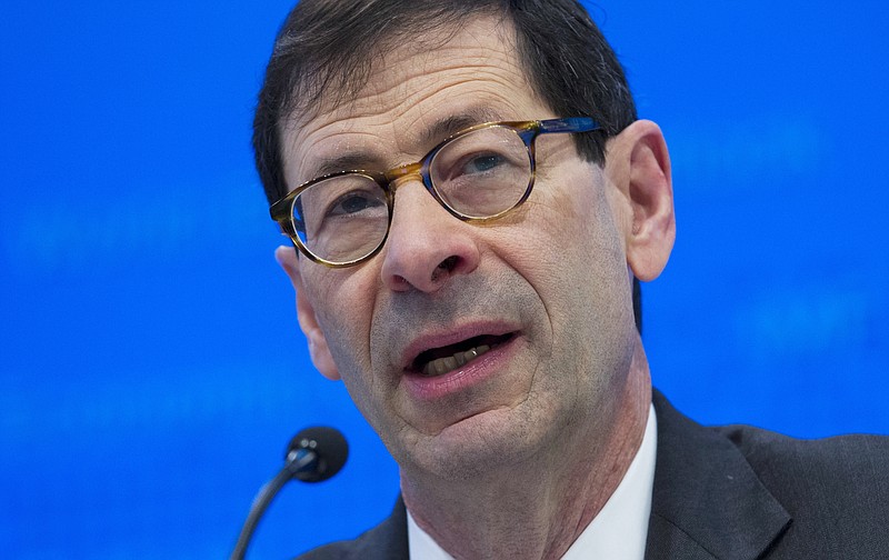 In this Tuesday, Oct. 4, 2016, file photo, International Monetary Fund Economic Counsellor Maurice Obstfeld speaks at a news conference during the World Bank/IMF Annual Meetings, at IMF headquarters in Washington. The IMF announced Monday, Jan. 16, 2017, it is raising its forecast for the U.S. economy in 2017 and in 2018, reflecting an expected boost from the economic policies of President-elect Donald Trump. "The global economic landscape started to shift in the second half of 2016," Obstfeld said, helped by a rebound in manufacturing activity in many countries and the financial market rally that started with Trump's November election victory. (AP Photo/Jose Luis Magana, File)