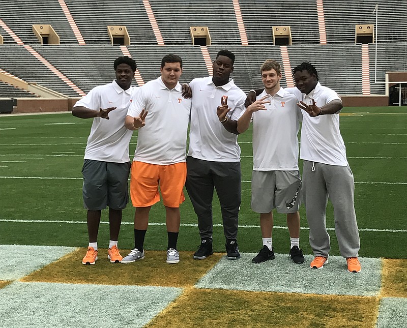 Tennessee's five football early enrollees pose inside Neyland Stadium after making their media debuts on Jan. 12, 2017. The newcomers are (left to right) defensive end Deandre Johnson, offensive linemen Riley Locklear and Trey Smith, quarterback Will McBride and linebacker Shanon Reid.