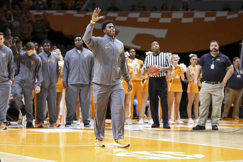 Defensive lineman Deandre Johnson waves to Tennessee fans as he's introduced during a timeout of the Vols' home basketball game against South Carolina on Jan. 11, 2017. Johnson is one of five early enrollees. (Photo By Craig Bisacre/Tennessee Athletics)