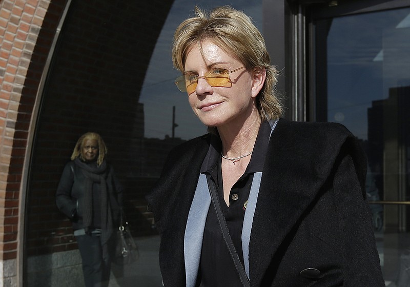 
              FILE - In a Thursday, Feb. 7, 2013 file photo, author Patricia Cornwell leaves federal court in Boston, after she took the stand in her lawsuit against her former financial management company. Cornwell settled a lawsuit Tuesday, Jan. 17, 2017, against her former business managers, avoiding a second trial for a case that dates to 2009. The author had claimed the New York accounting firm Anchin, Block & Anchin LLP was negligent in handling her finances and cost her millions in losses or unaccounted for revenue. (AP Photo/Steven Senne, File)
            