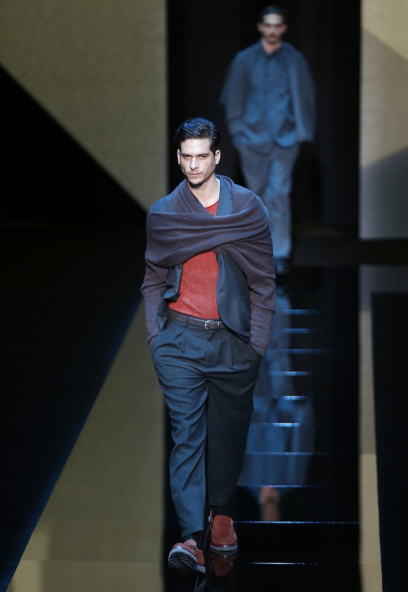 
              Models wear creations for Giorgio Armani men's Fall-Winter 2017-2018 collection, part of the Milan Fashion Week, unveiled in Milan, Italy, Tuesday, Jan. 17, 2017. (AP Photo/Antonio Calanni)
            