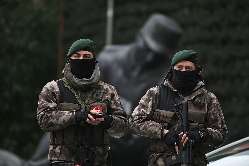 
              Turkish police officers stand guard at Istanbul's headquarters prior to a news conference regarding the arrest of a suspect of New Year's nightclub attack, in Istanbul, Tuesday, Jan. 17, 2017. Turkish officials on Tuesday confirmed that the gunman who carried out the deadly New Year's attack on an Istanbul nightclub, which was claimed by the Islamic State group, has been detained. (AP Photo/Lefteris Pitarakis)
            