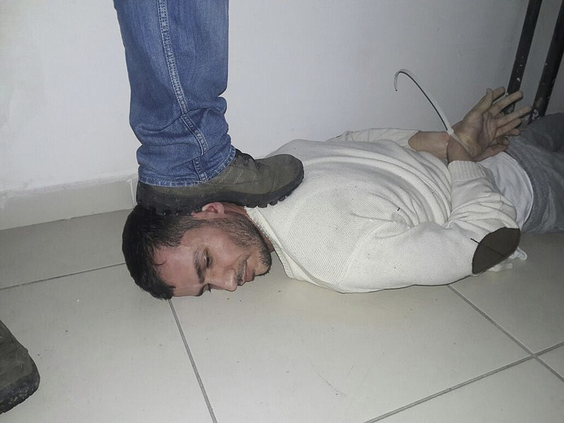 
              An unidentified man is subdued, detained during a police operation to capture Reina club attacker, in Istanbul, Turkey, late Monday, Jan. 16, 2017.  Turkish media reports say police have caught the gunman who killed 39 people during New Year's celebrations on an Istanbul nightclub, detained during a police operation. (Depo Photos via AP)
            