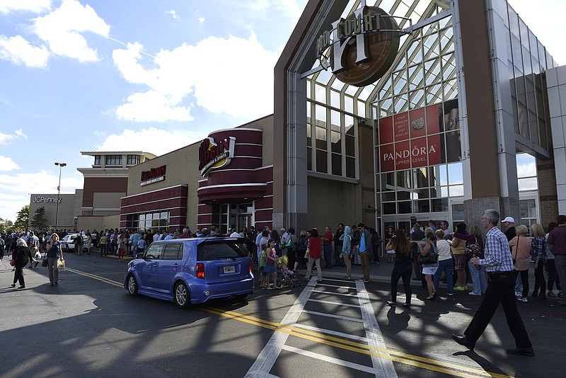 People line up from the front of the Barnes and Noble bookstore to beyond the main mall entrance as Republican presidential candidate Dr. Ben Carson meets supporters at a book signing at the bookstore at the Hamilton Place Mall on Sunday, Oct. 11, 2015, in Chattanooga, Tenn. 