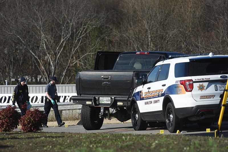 Officers investigate the scene Wednesday, January 18, 2017 where a suspect was fatally shot by Hamilton County deputies after a vehicle pursuit ended Tuesday night at the 200 block of Sequoyah-Access Road in Soddy-Daisy.  