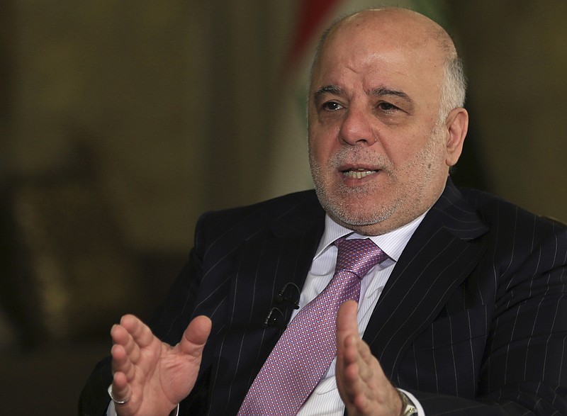 
              FILE - In this Monday, Nov. 28, 2016, file photo, Iraq's Prime Minister Haider al-Abadi speaks during an interview with the Associated Press in Baghdad. Iraq’s prime minister is demanding full disclosure about events surrounding the 2003 U.S.-led invasion of Iraq. Haider al-Abadi says he would like to see a “thorough investigation” of America’s decision-making that took the U.S. forces from “liberating” the country from “Saddam (Hussein’s) terrorist regime” to “occupying” Iraq. (AP Photo/Khalid Mohammed, File)
            