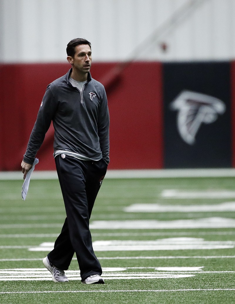 
              Atlanta Falcons offensive coordinator Kyle Shanahan walks on the field during an NFL football practice , Thursday, Jan. 19, 2017, in Flowery Branch, Ga.. The Falcons will face the Green Bay Packers in the NFC Championship on Sunday in Atlanta. (AP Photo/John Bazemore)
            