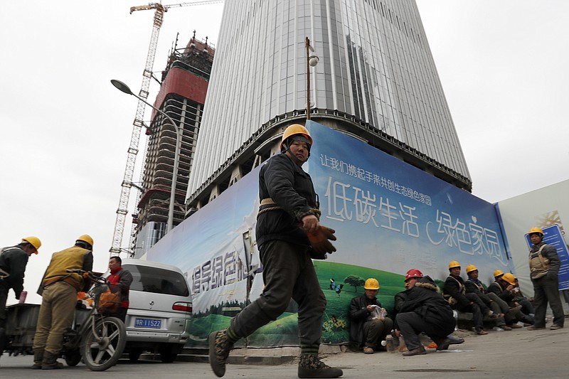 
              In this Dec. 13, 2016 photo, workers buy their lunch outside a construction site at the Central Business District in Beijing. China's economic growth accelerated slightly in the final quarter of 2016 but its full-year performance still was the weakest in nearly three decades. The government reported Friday, Jan. 20, 2017 the world's second-largest economy expanded by 6.8 percent in the fourth quarter over a year earlier, up from the previous quarter's 6.7 percent. Full-year growth was 6.7 percent, down from 2015's 6.9 percent and the weakest since 1990. (AP Photo/Andy Wong)
            