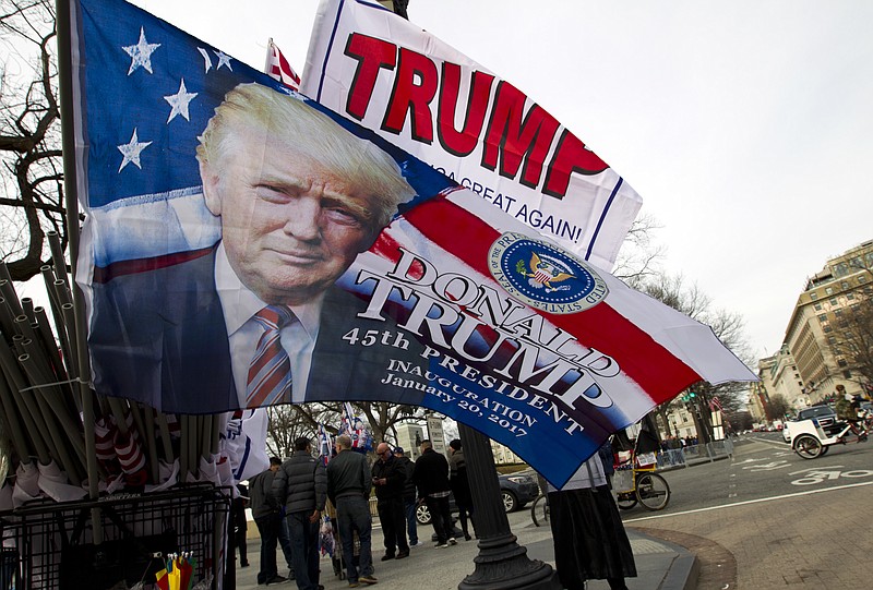 
              Flags with the image of President-elect Donald Trump are displayed for sale on Pennsylvania Avenue in Washington, Thursday, Jan. 19, 2017,  ahead of Friday's inauguration. ( AP Photo/Jose Luis Magana)
            