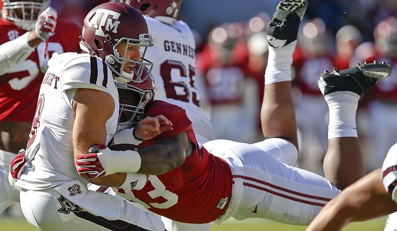 Former Alabama defensive end Jonathan Allen, shown here sacking Texas A&M's Trevor Knight in October, is projected to go third overall to the Chicago Bears according to longtime draft analyst Mel Kiper.