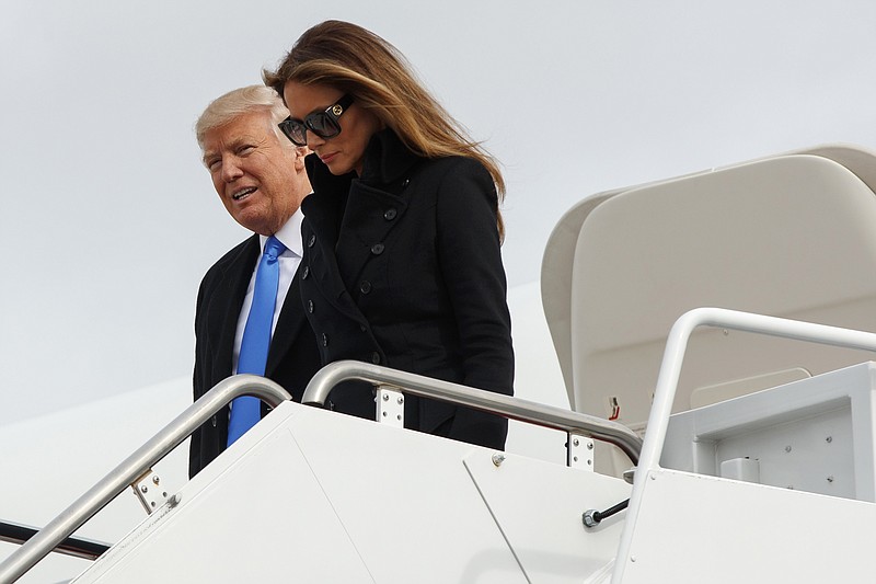 
              President-elect Donald Trump and his wife Melania Trump arrive at Andrews Air Force Base, Md., Thursday, Jan. 19, 2017, ahead of Friday's inauguration. (AP Photo/Evan Vucci)
            
