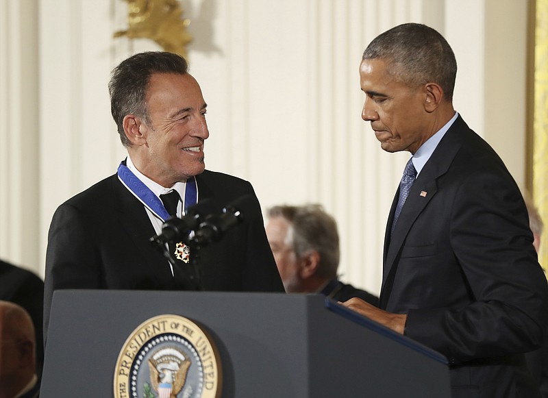 
              FILE - In this Nov. 22, 2016, file photo, President Barack Obama presents the Presidential Medal of Freedom to singer songwriter Bruce Springsteen during a ceremony in the East Room of the White House. Springsteen gave a private concert at the White House on Jan. 12, 2017, for longtime Obama staffers. (AP Photo/Manuel Balce Ceneta, File)
            