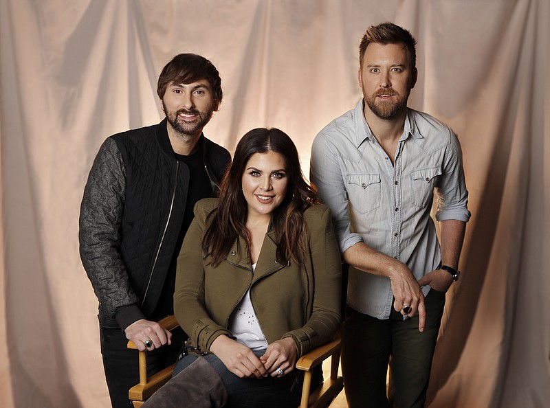 
              In this Jan. 9, 2017, photo, the members of Lady Antebellum, from left, Dave Haywood, Hillary Scott, and Charles Kelley pose in Nashville, Tenn. The Grammy-winning vocal group released a new single, “You Look Good,” Thursday, Jan. 19, from their forthcoming album “Heart Break,” which comes out on June 9. (AP Photo/Mark Humphrey)
            