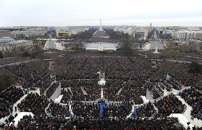 
              FILE - This Jan. 21, 2013 file photo shows an overall view of President Barack Obama taking the oath of office from Chief Justice John Roberts at the ceremonial swearing-in on the West Front of the U.S. Capitol during the 57th Presidential Inauguration in Washington. The inaugural committee released the lunch menu following the swearing-in ceremonies for President-elect Donald Trump. Some 200 guests will be tucking into a first course of Maine lobster and Gulf shrimp in a saffron sauce, Angus beef from Virginia with Idaho potatoes and a dark chocolate sauce, and a chocolate souffle with cherry vanilla ice cream. (AP Photo/Saul Loeb, File)
            