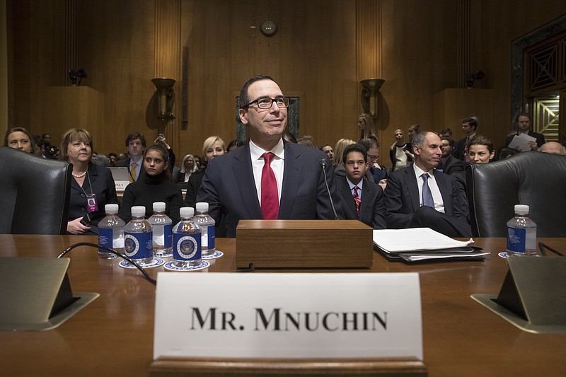Treasury Secretary-designate Steven Mnuchin arrives on Capitol Hill in Washington, Thursday, Jan. 19, 2017, to testify at his confirmation hearing before the Senate Finance Committee. Mnuchin built his reputation and his fortune as a savvy Wall Street investor but critics charge that he profited from thousands of home foreclosures as the chief of a sub-prime mortgage lender during the housing collapse. (AP Photo/J. Scott Applewhite)