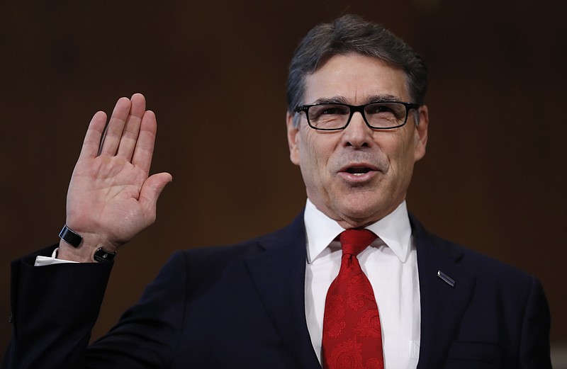 Energy Secretary-designate, former Texas Gov. Rick Perry, is sworn-in on Capitol Hill in Washington, Thursday, Jan. 19, 2017, prior to testifying at his confirmation hearing before the Senate Energy and Natural Resources Committee. (AP Photo/Carolyn Kaster)