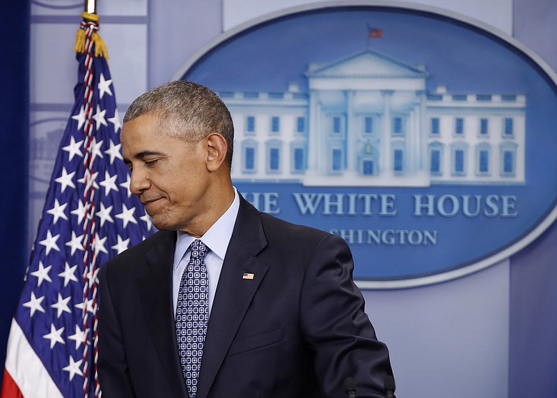 
              President Barack Obama leaves the podium at the conclusion of his final presidential news conference, Wednesday, Jan. 18, 2017, in the briefing room of the white House in Washington.(AP Photo/Pablo Martinez Monsivais)
            