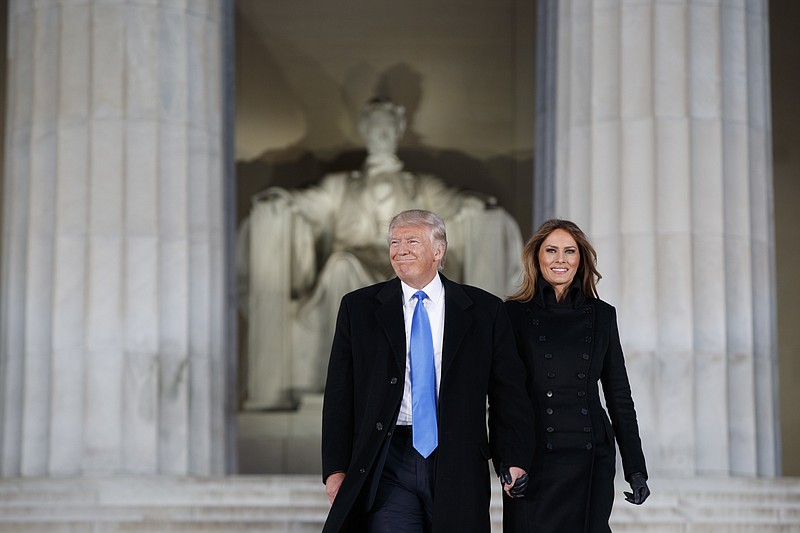
              President-elect Donald Trump, left, and his wife Melania Trump arrive to the "Make America Great Again Welcome Concert" at the Lincoln Memorial, Thursday, Jan. 19, 2017, in Washington. (AP Photo/Evan Vucci)
            