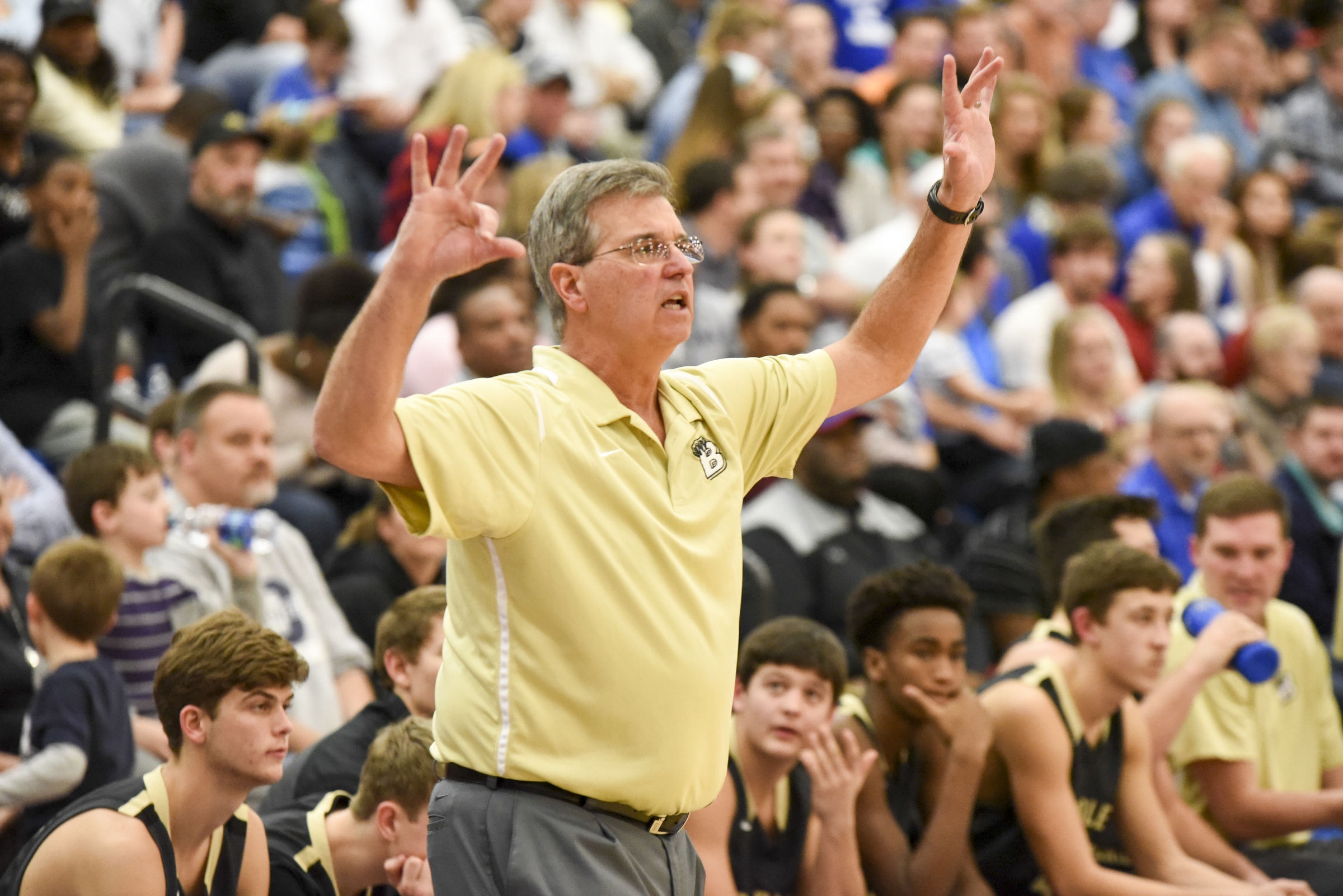 Bradley Central coach Chuck Clark raises his hands as the Bears go on defense in first half action at Cleveland Friday night.
