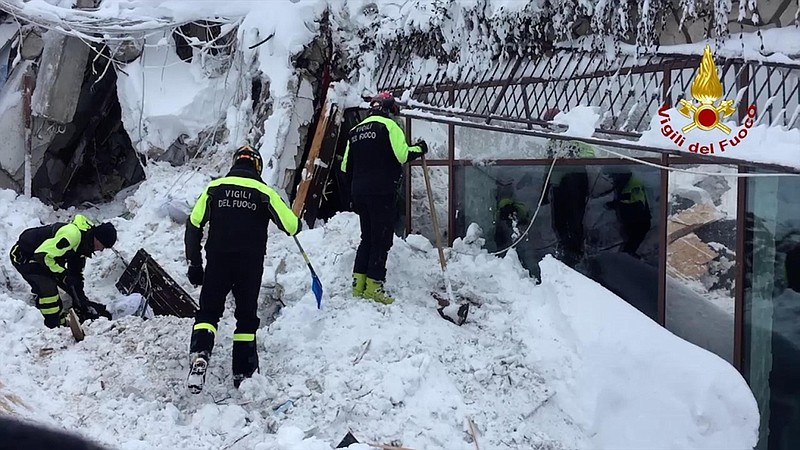 
              Italian firefighters search for survivors after an avalanche buried a hotel near Farindola, central Italy, Thursday, Jan. 19, 2017. Rescue crews are continuing the painstaking search for some 30 people trapped inside a remote Italian mountain resort flattened by a huge avalanche. (Italian Firefighters/ANSA via Italian Firefighters)
            