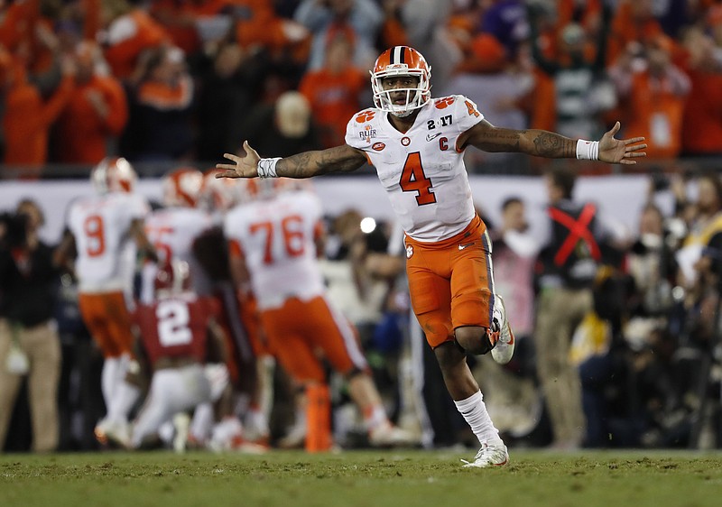 
              FILE - In this Jan. 10, 2017, file photo, Clemson's Deshaun Watson celebrates a last second touchdown pass to Hunter Renfrow during the second half of the NCAA college football playoff championship game against Alabama, in Tampa, Fla. The NFL on Friday, Jan. 20, 2017, released a list of 95 underclassmen who have been granted early entry to the draft, along with the names of eight other players, including Clemson quarterback Deshaun Watson, who are draft-eligible by completing their college degrees. (AP Photo/John Bazemore, File)
            