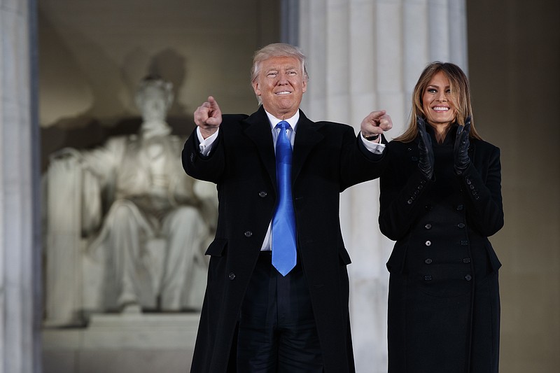 President-elect Donald Trump, left, and his wife Melania Trump arrive to the "Make America Great Again Welcome Concert" at the Lincoln Memorial, Thursday, Jan. 19, 2017, in Washington. (AP Photo/Evan Vucci)