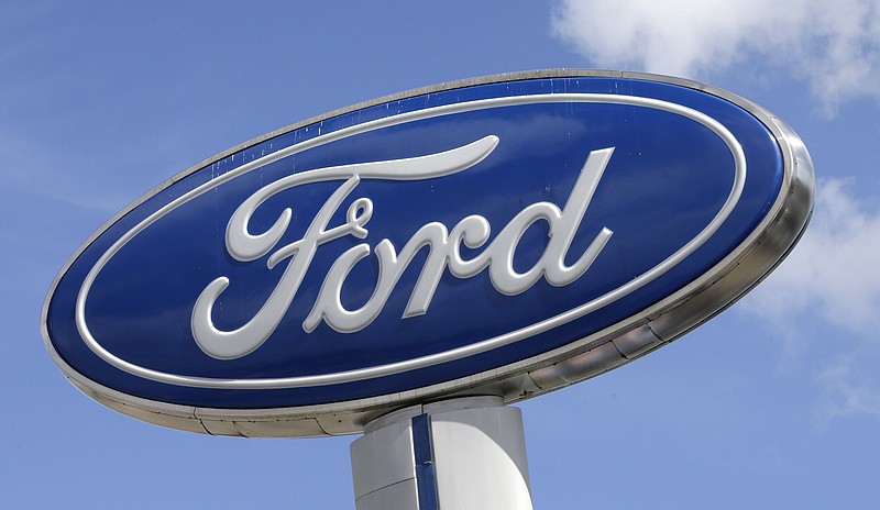 
              This Tuesday, Jan. 17, 2017, photo shows a Ford sign at an auto dealership, in Hialeah, Fla. Ford Motor Co. says a change in the way it values pension assets will cut 2016 full-year net income by $2 billion. (AP Photo/Alan Diaz)
            