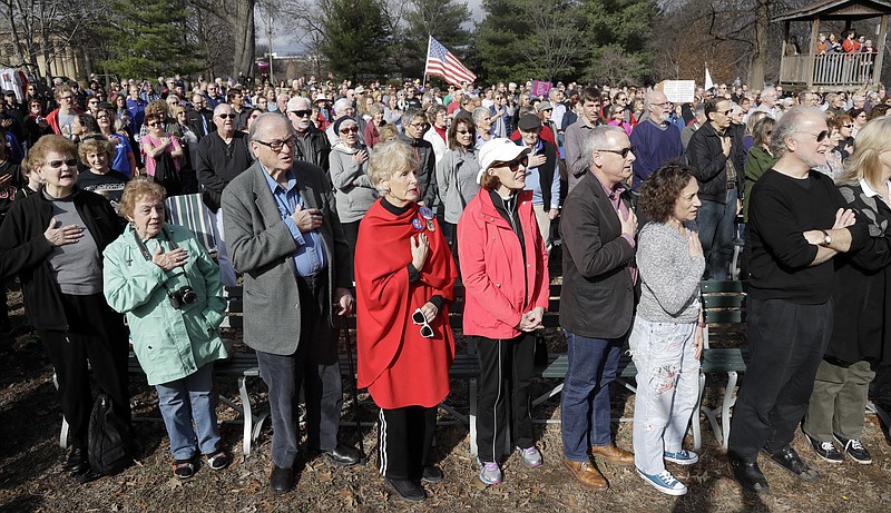 
              People recite the Pledge of Allegiance during a protest Friday, Jan. 20, 2017, in Nashville, Tenn., organized to combat harsh rhetoric by Donald Trump. The protesters observed 15 minutes of silence during the time Trump took the Presidential oath of office in Washington. (AP Photo/Mark Humphrey)
            